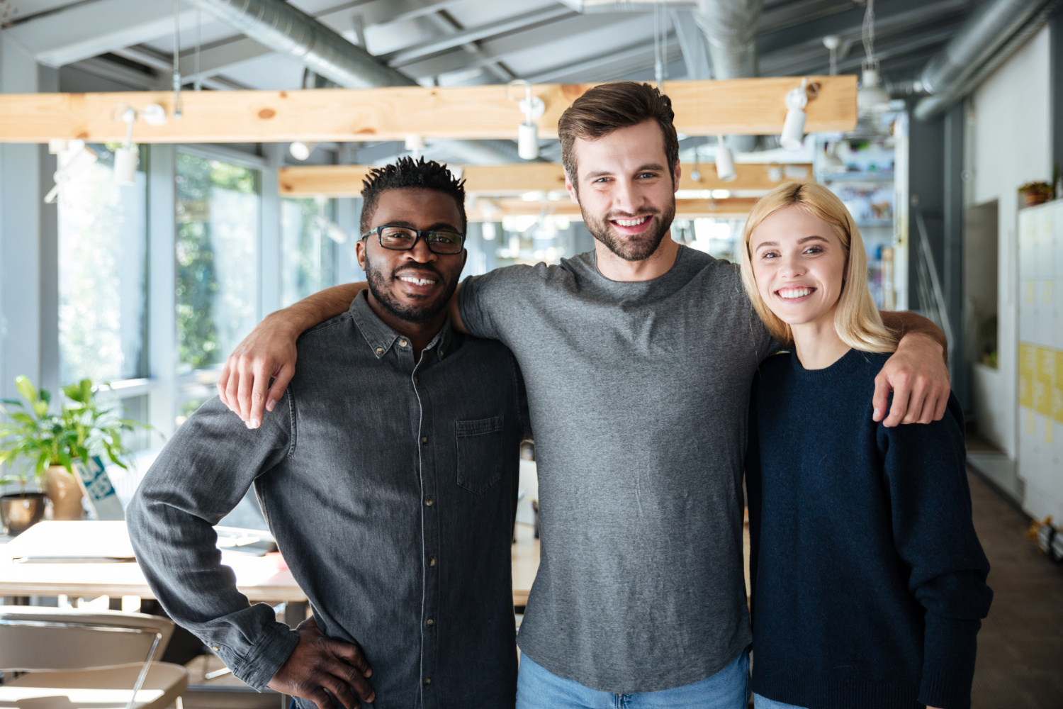 Smiling young colleagues